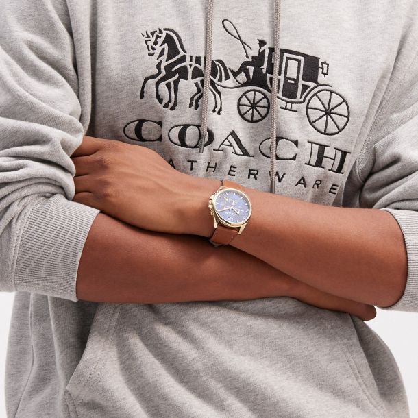 Coach couple watch top