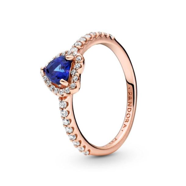Rose gold ring best sale with blue stone