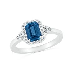 Emerald-Shaped London Blue Topaz and 1/5ctw Diamond Halo White Gold Ring