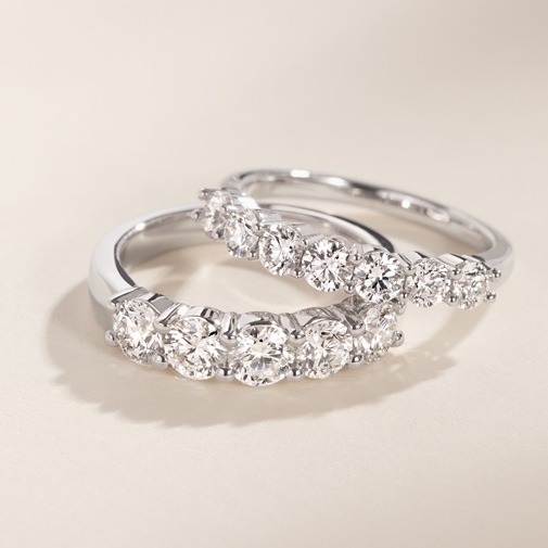 Diamond band engagement ring with diamonds set across the shank