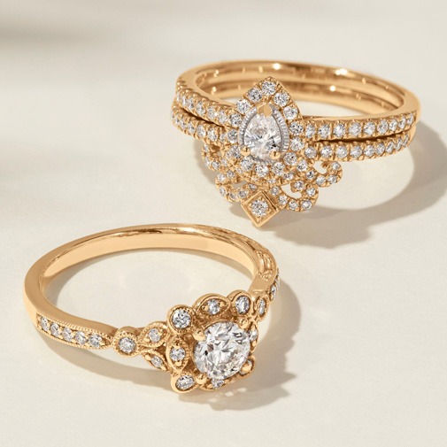 Vintage style diamond engagement ring with intricate detailing and antique inspired design