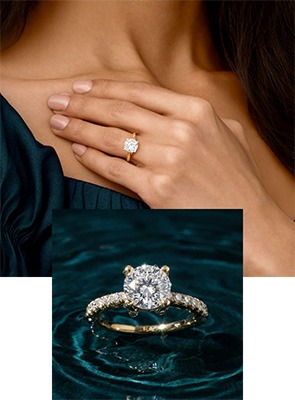 Woman wearing an ECONIC Star lab-grown diamond engagement ring and a halo-style lab-grown diamond engagement ring