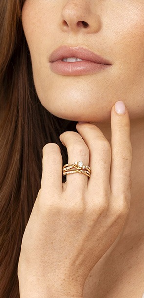 Woman wearing stacked yellow gold Ellaura Bridal rings