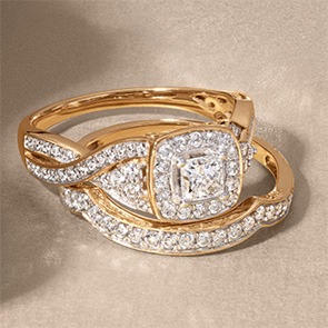 Cushion-cut yellow gold engagement ring with matching diamond bands