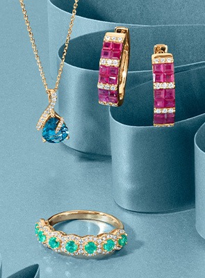 Colorful gemstone jewelry including rings and earrings with vibrant stones