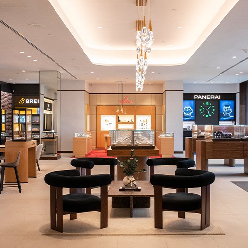 Interior of a REEDS Jewelers luxury watch showroom with display cases
