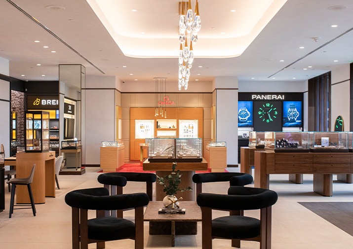 Interior of a REEDS Jewelers luxury watch showroom with display cases