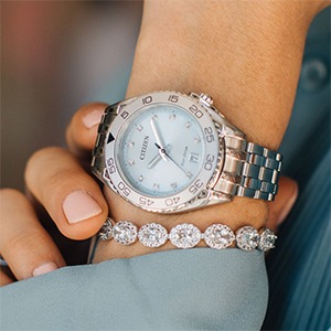 Light blue dial watch with diamond bracelet styling for cool skin tones