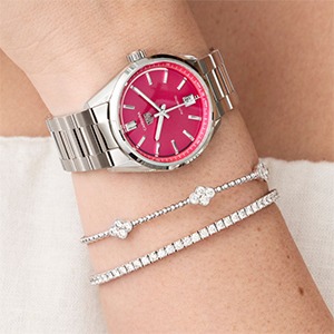 Bright pink dial watch with silver bracelet styling for cool skin tones