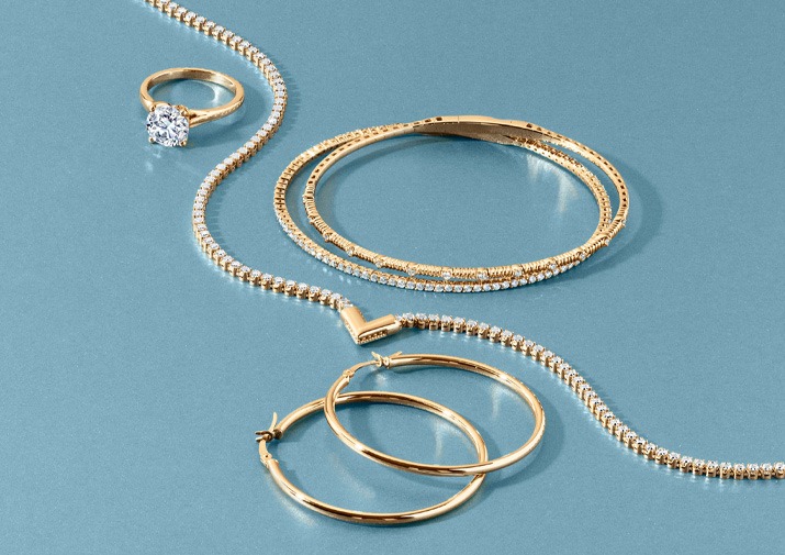 Gold with round diamond accent necklace and bangles with round diamond ring and hoop earrings &ndash; trendy Mother&rsquo;s Day gift idea